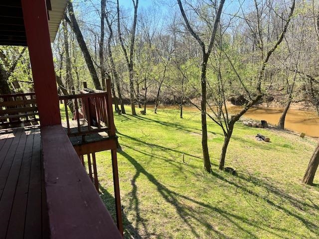 590 Towboat Lane Adamsville, TN 38310 - Photo 10 of 39 View of yard featuring a wooden deck
