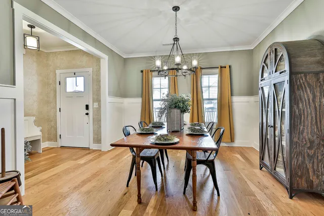 a view of a dining room with furniture window and wooden floor