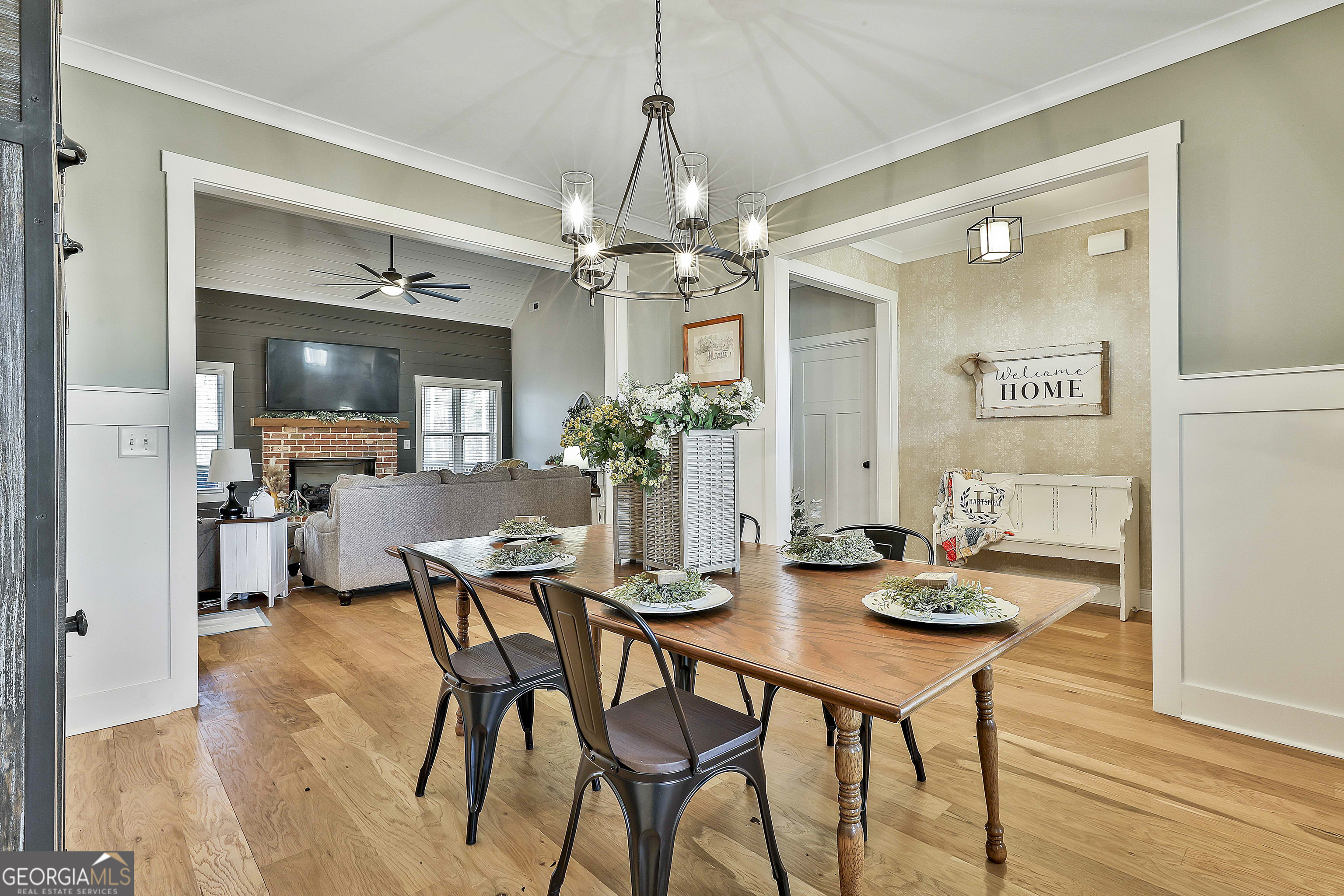 255 Werner Way Senoia, GA 30276 - Photo 12 of 47 a view of a dining room with furniture and wooden floor