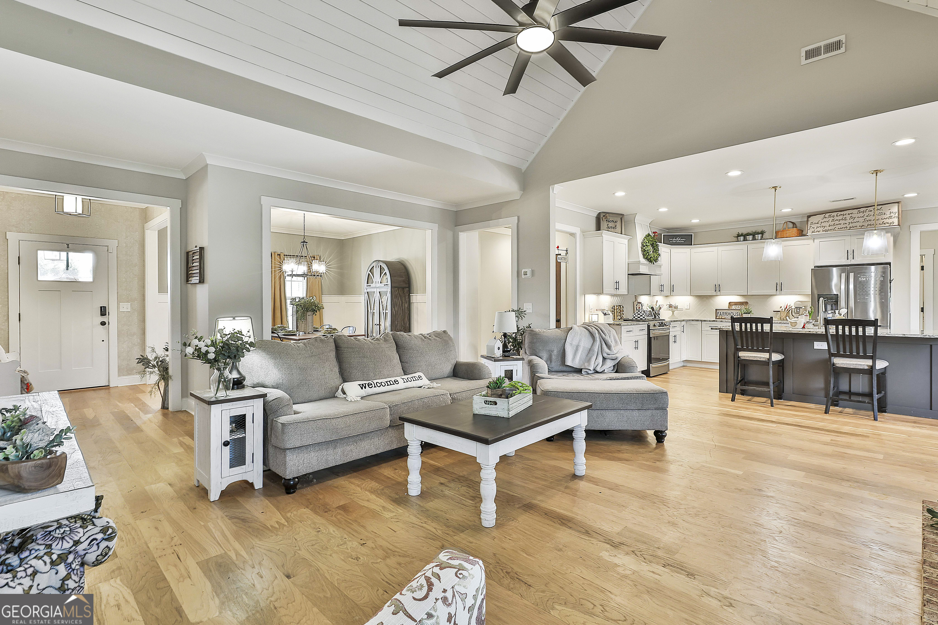 255 Werner Way Senoia, GA 30276 - Photo 16 of 47 a living room with furniture and a view of kitchen