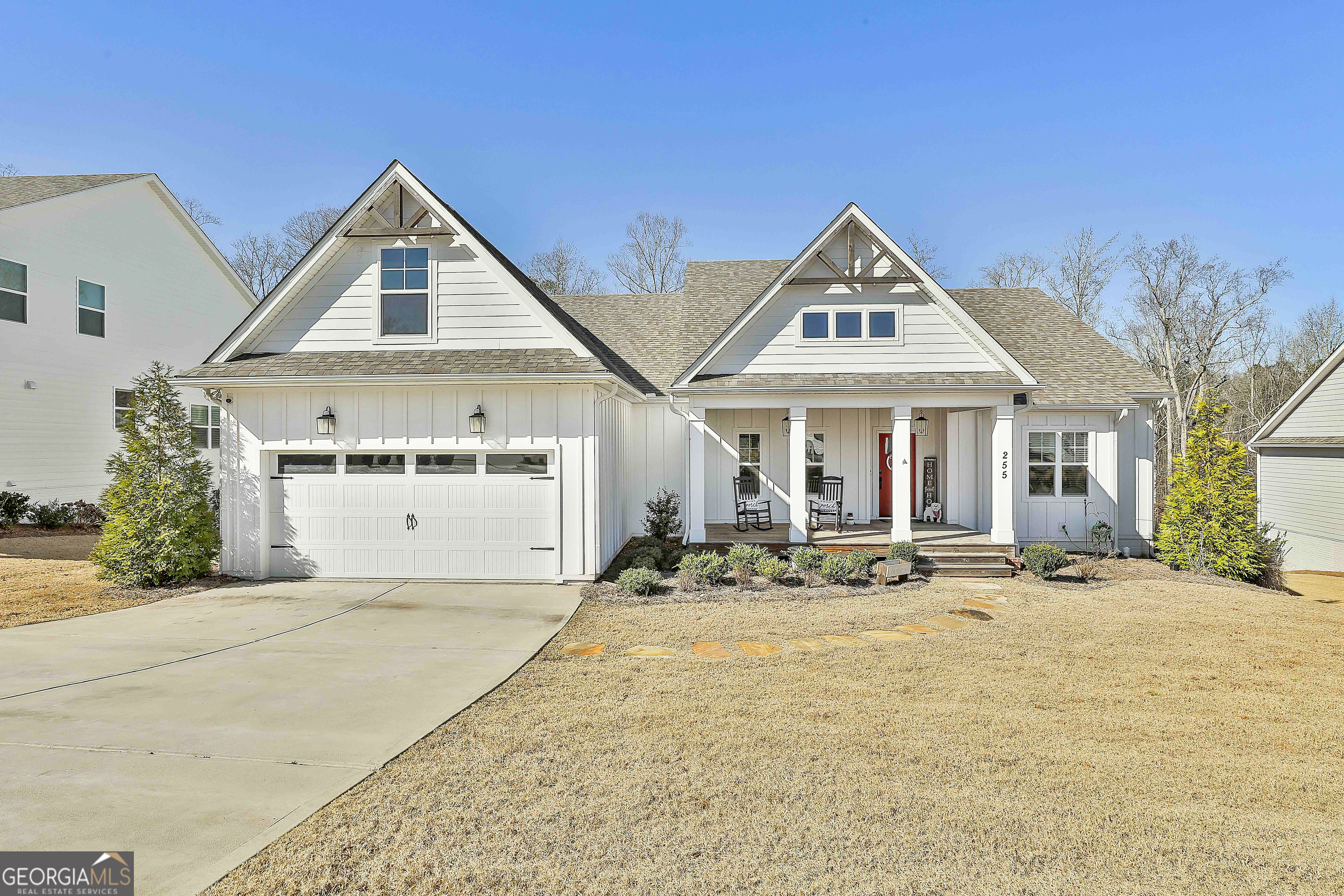 255 Werner Way Senoia, GA 30276 - Photo 2 of 47 a front view of house with yard outdoor seating and garage