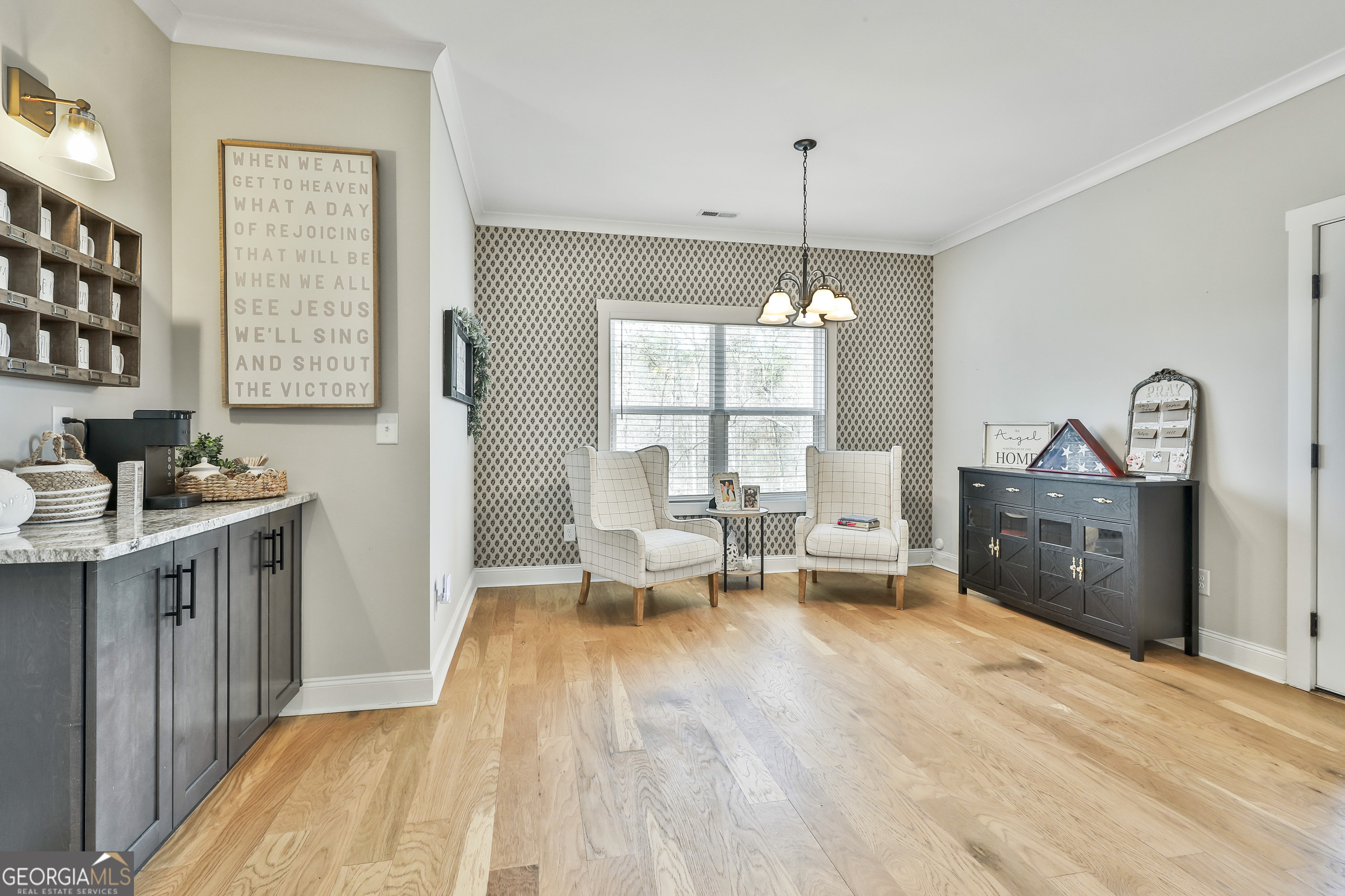 255 Werner Way Senoia, GA 30276 - Photo 22 of 47 a spacious bedroom with a bed a chandelier and a dresser