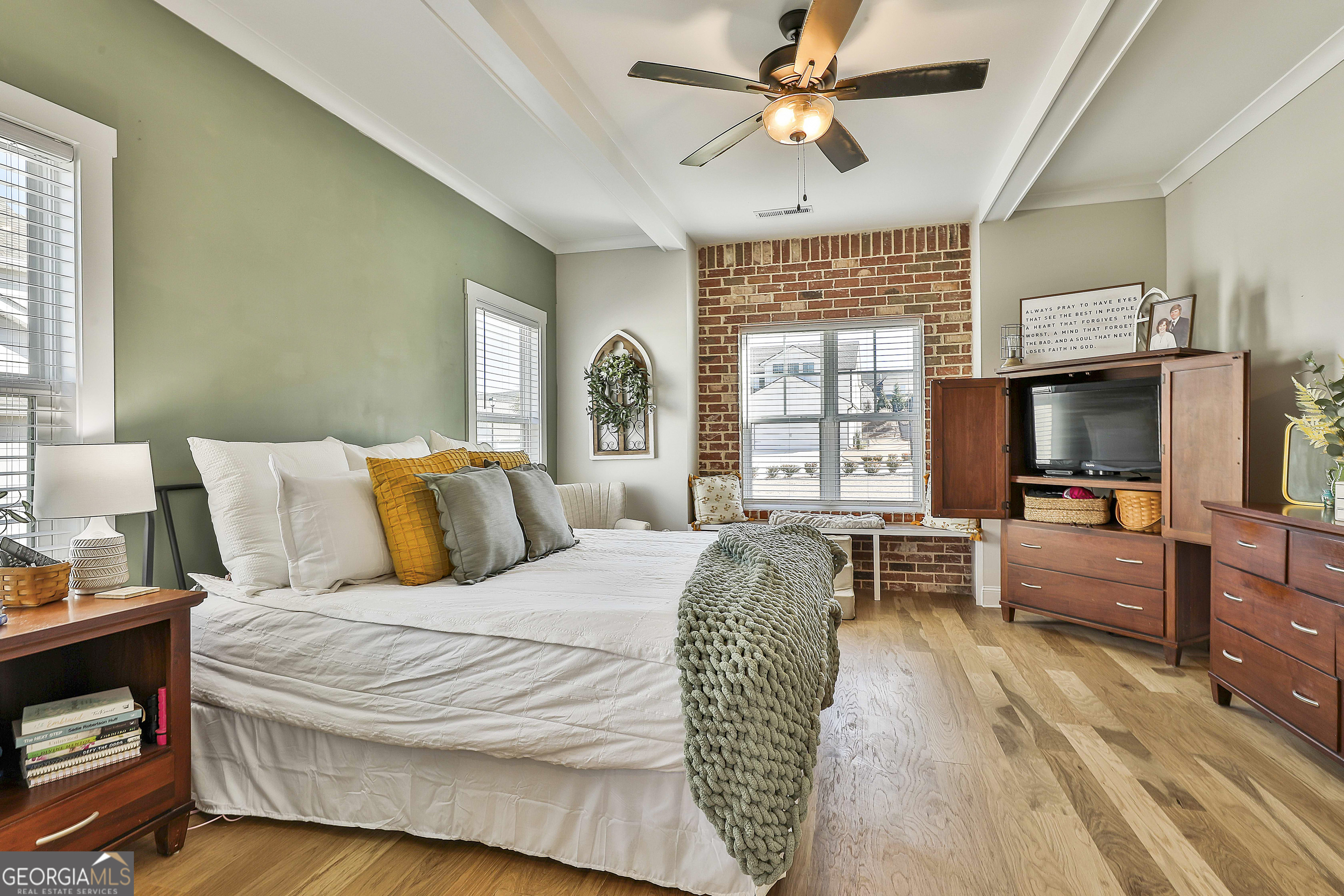 255 Werner Way Senoia, GA 30276 - Photo 28 of 47 a bedroom with a bed and a chandelier