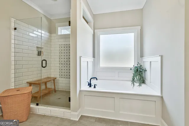 a bathroom with a shower and a bathtub