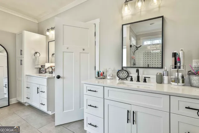 a bathroom with double vanity sink and mirror