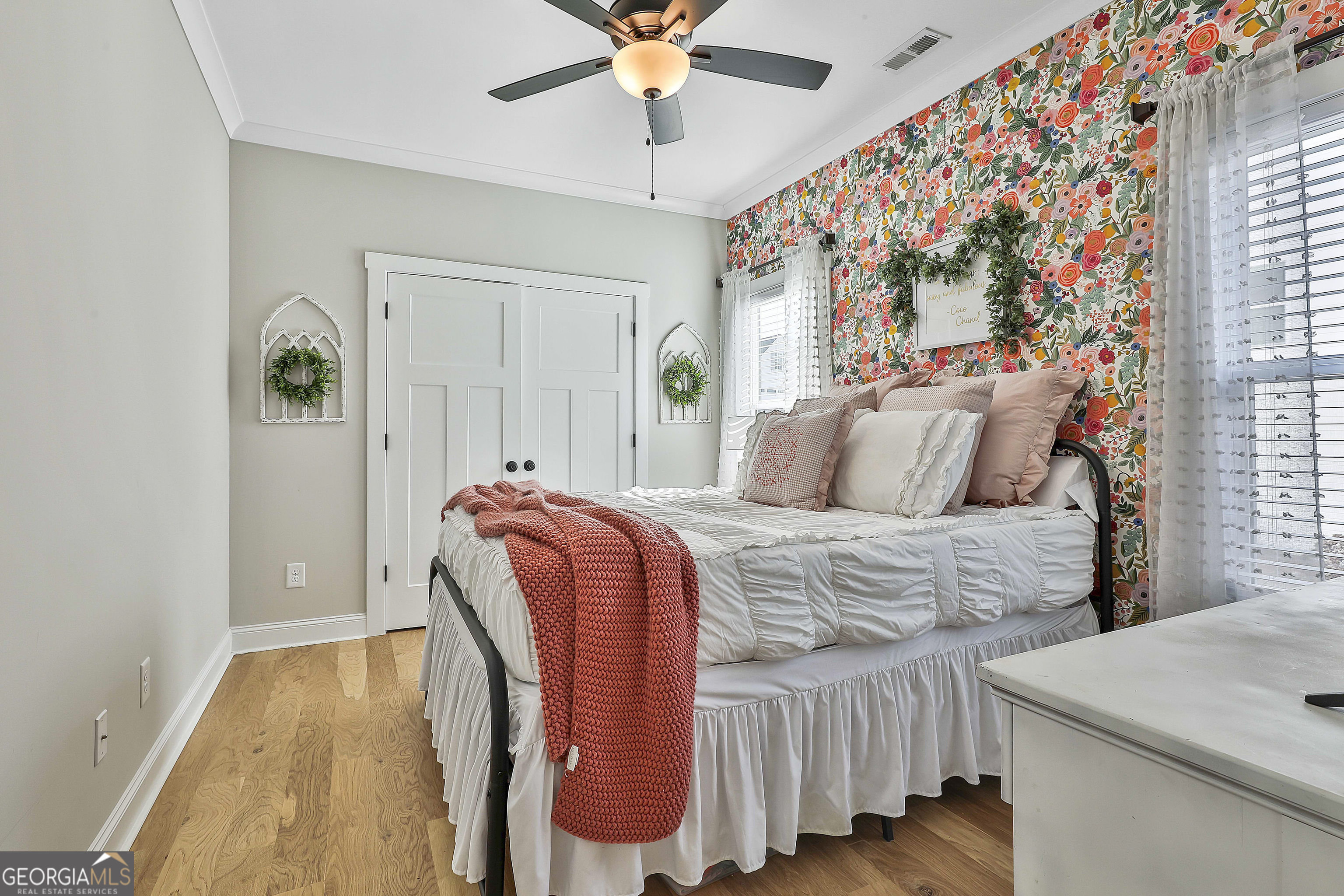 255 Werner Way Senoia, GA 30276 - Photo 35 of 47 a bedroom with a bed and a chandelier