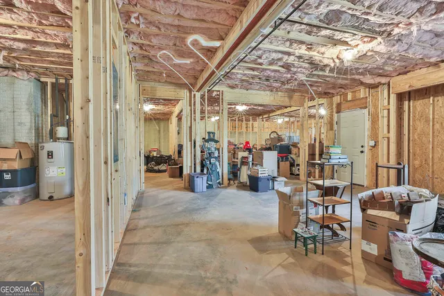 a view of a hallway with dining area and glass windows