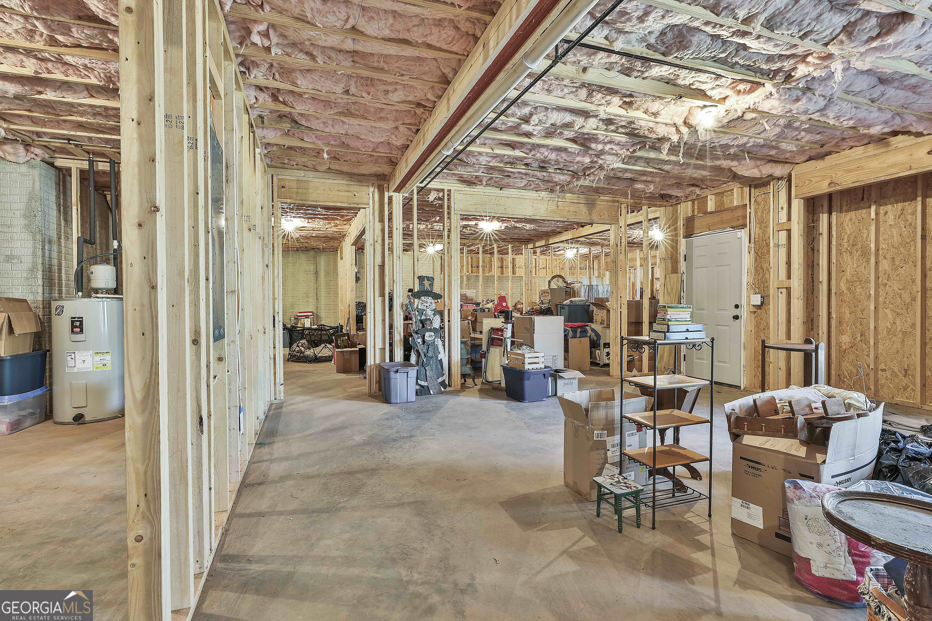 255 Werner Way Senoia, GA 30276 - Photo 41 of 47 a view of a hallway with dining area and chandelier