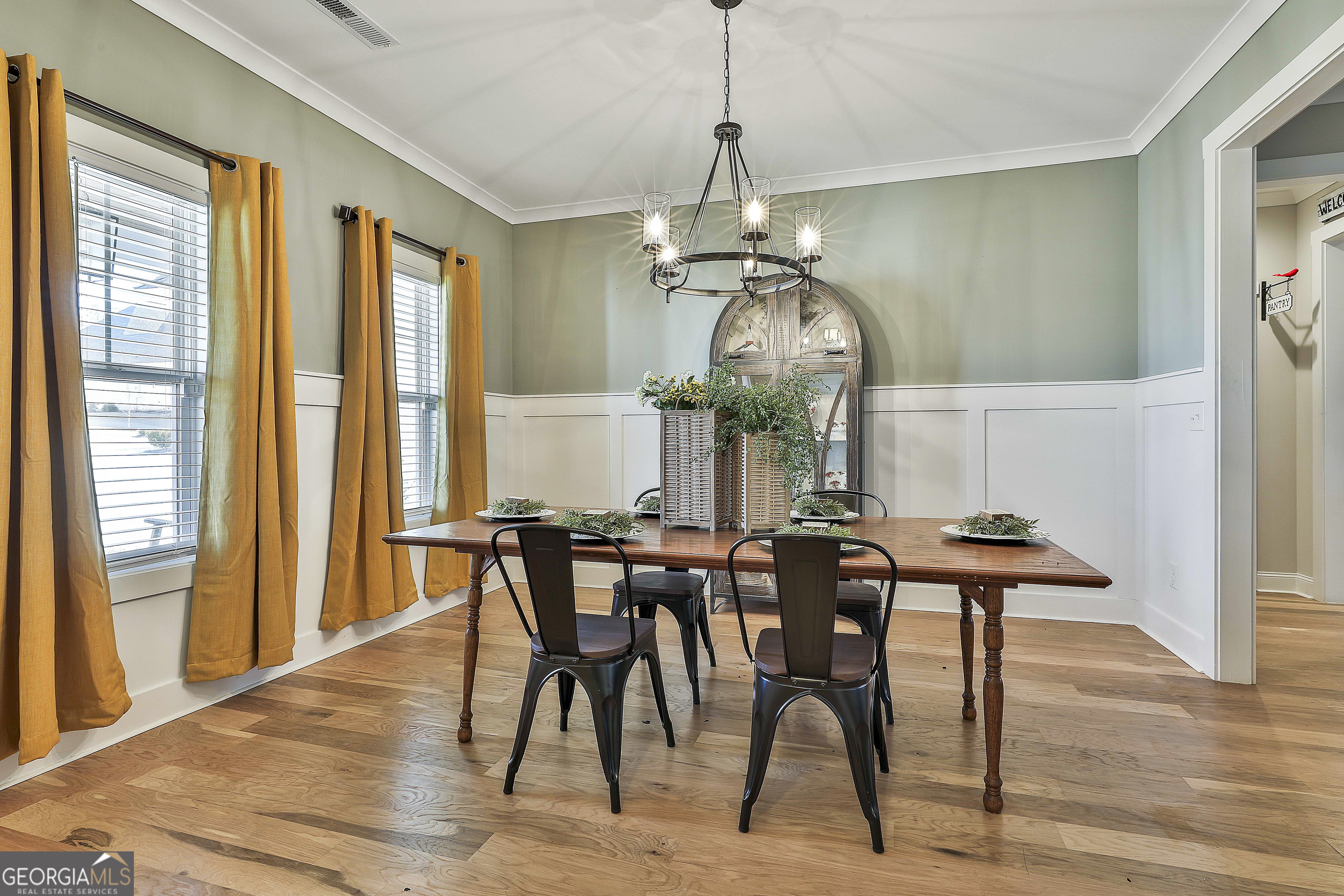 255 Werner Way Senoia, GA 30276 - Photo 10 of 47 a view of a dining room with furniture window and wooden floor