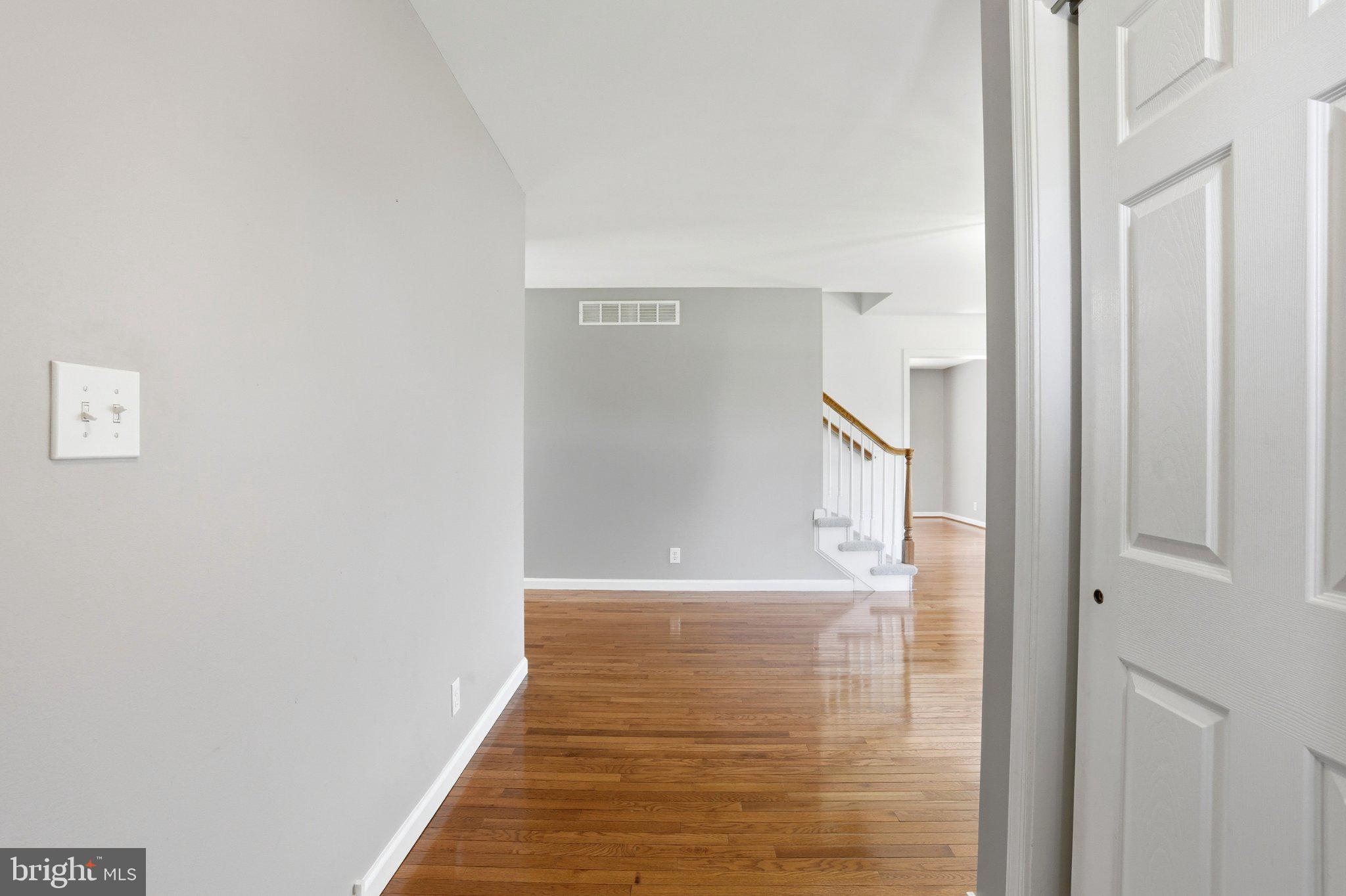 Inviting entryway with gleaming floors.