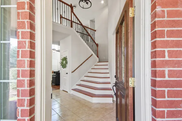 a view of a brick wall and door