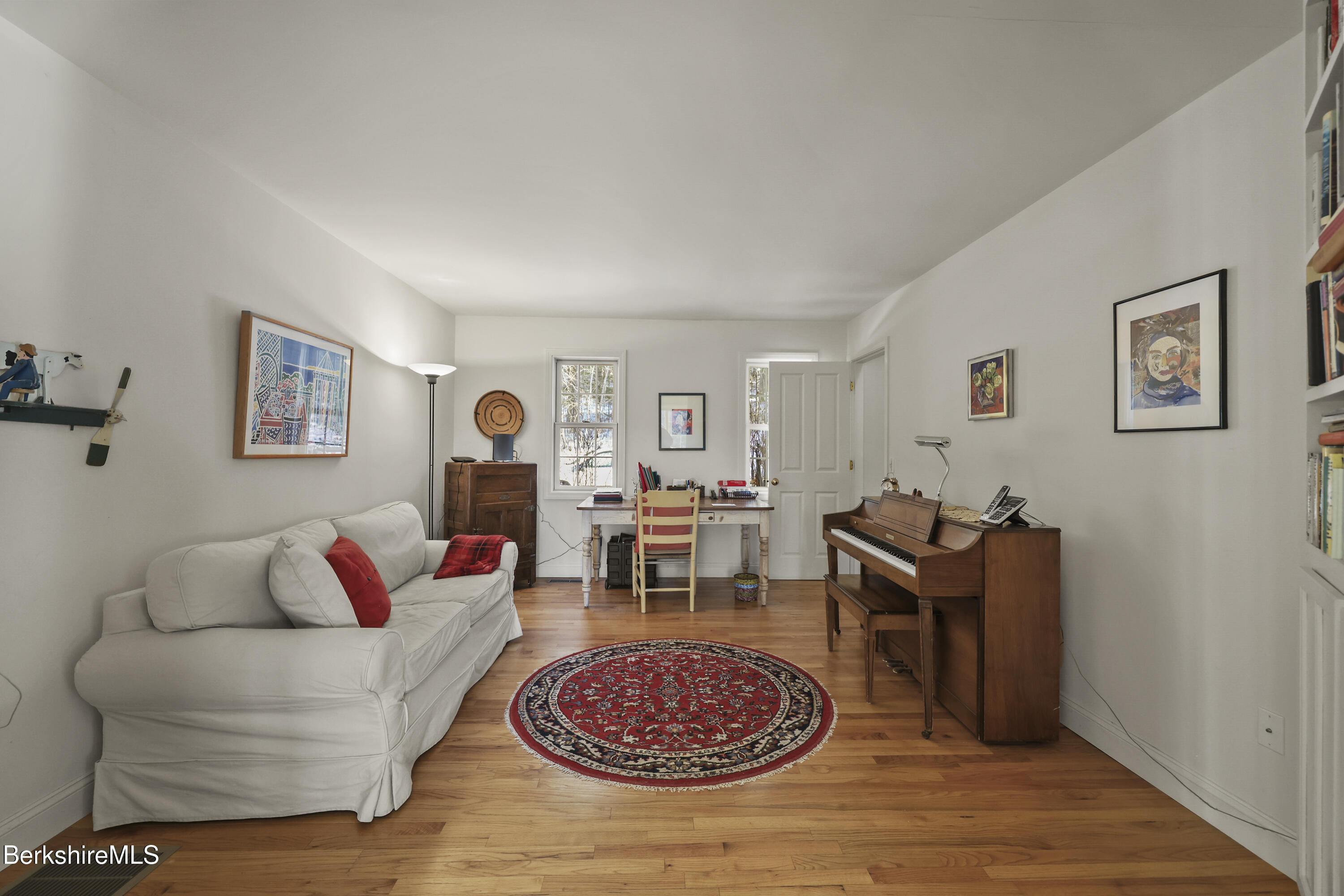 130 E Road Alford, MA 01266 - Photo 16 of 29 a living room with furniture a rug and wall paintings