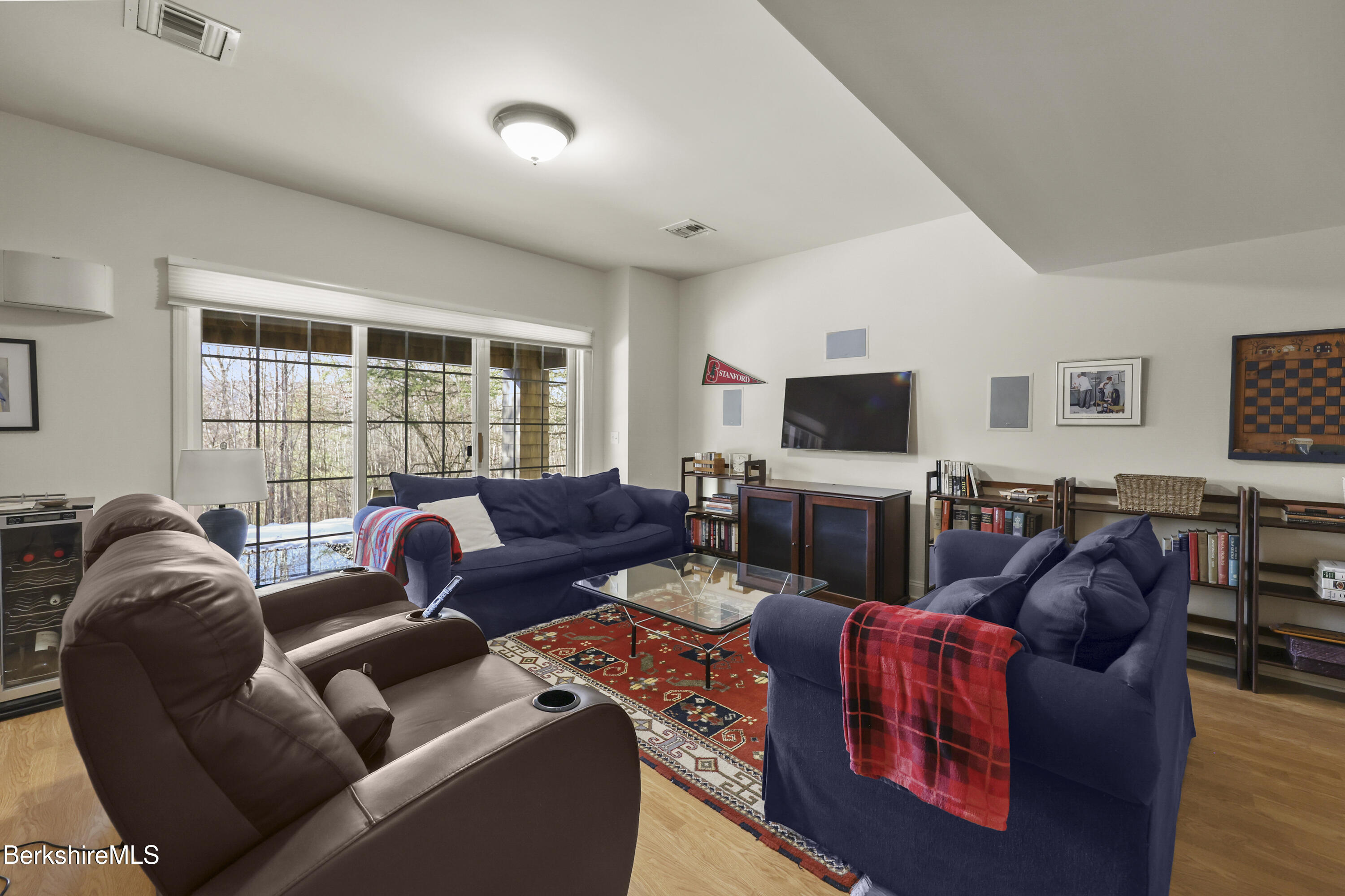130 E Road Alford, MA 01266 - Photo 20 of 29 a living room with furniture a flat screen tv and a window