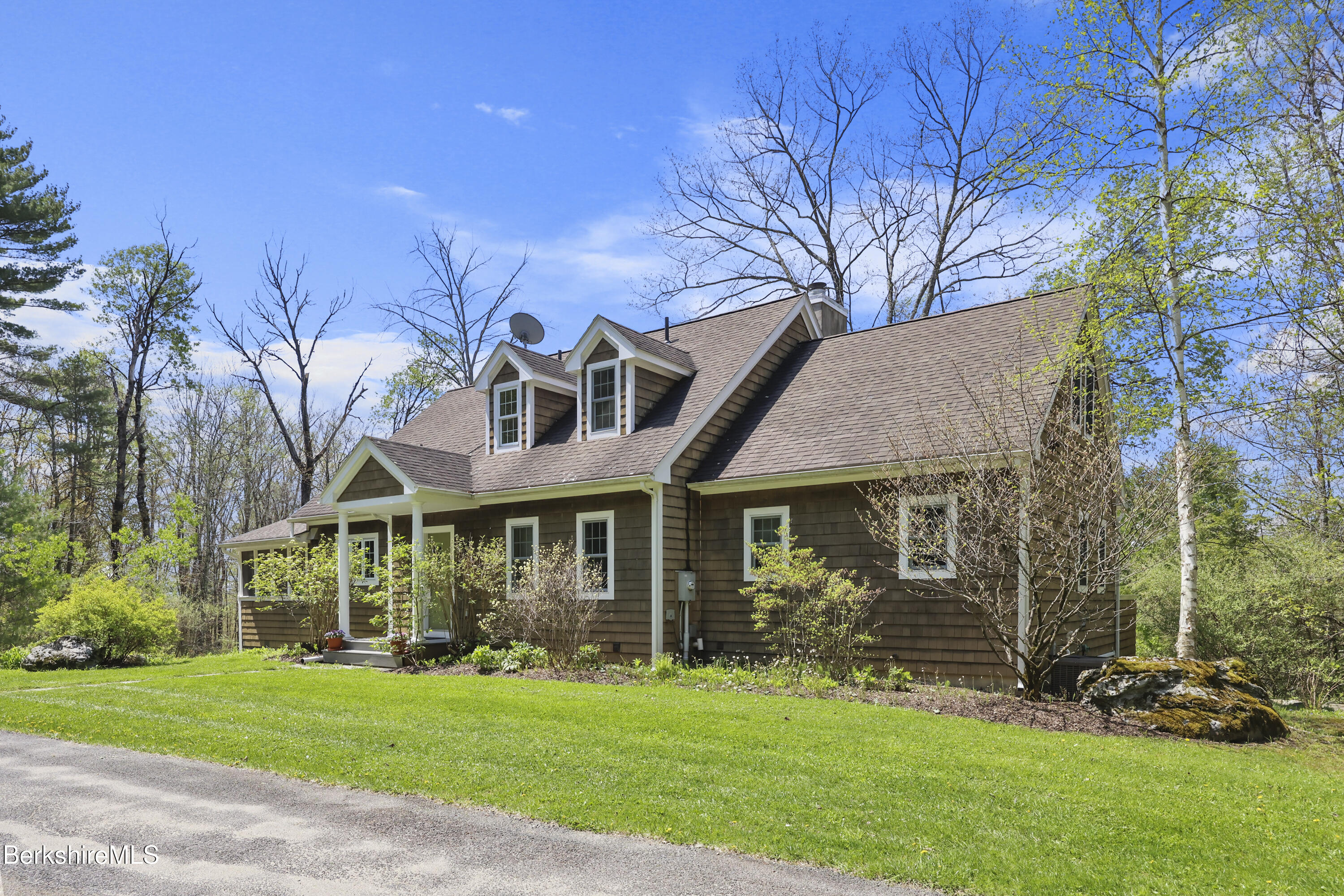 130 E Road Alford, MA 01266 - Photo 2 of 29 a front view of a house with a garden