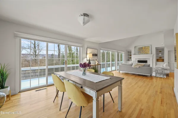 a large kitchen with stainless steel appliances granite countertop a stove a sink and a granite counter top