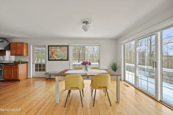 a kitchen with granite countertop a sink stainless steel appliances and cabinets