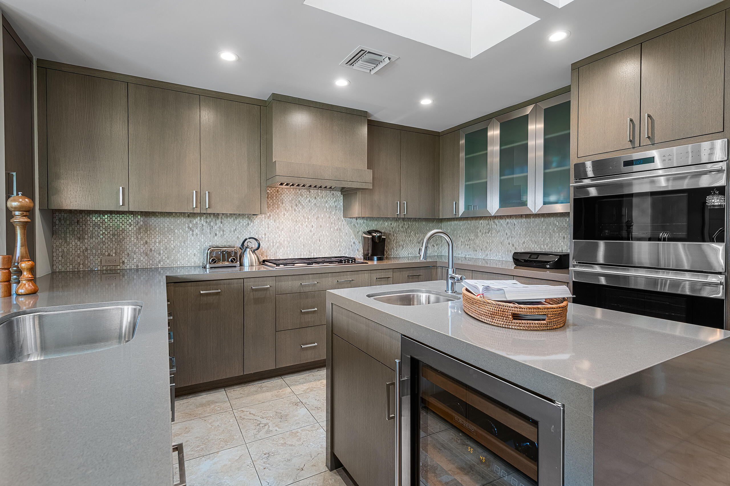 18 Creekside Drive Rancho Mirage, CA 92270 - Photo 14 of 40 a kitchen with a sink a stove and cabinets