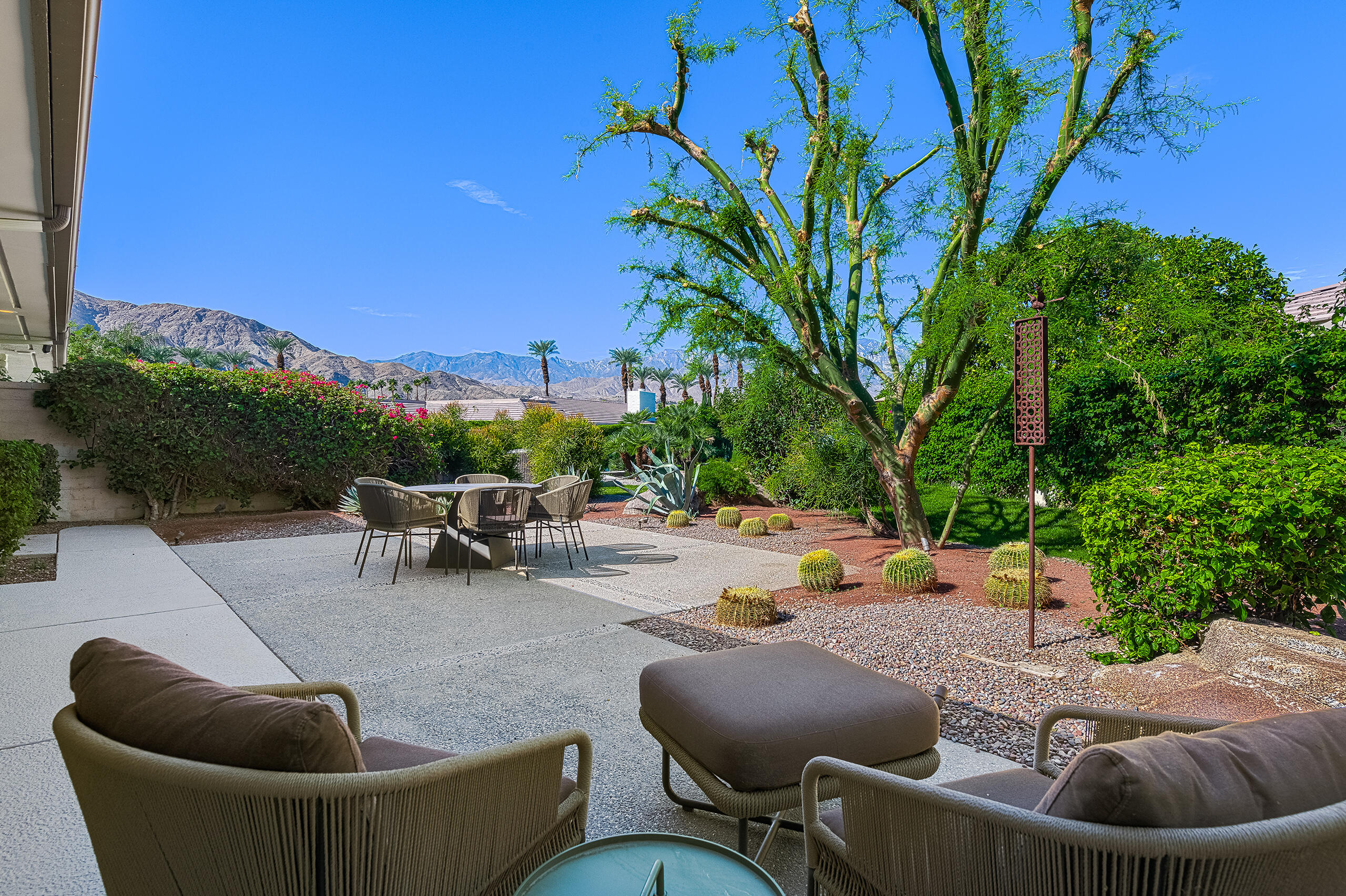 18 Creekside Drive Rancho Mirage, CA 92270 - Photo 17 of 40 a view of a patio with couches and a fire pit