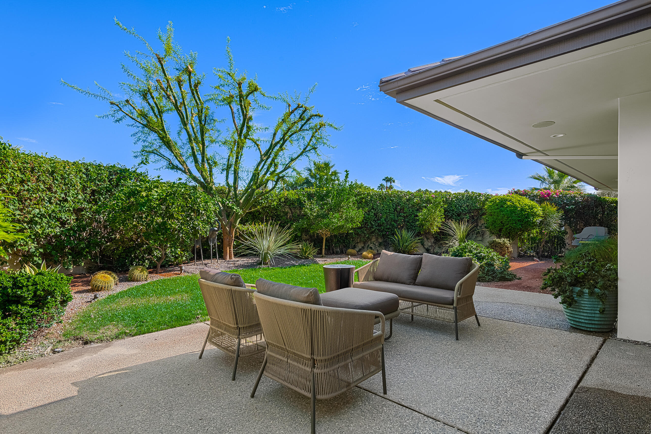18 Creekside Drive Rancho Mirage, CA 92270 - Photo 24 of 40 a view of yard with seating area and green space