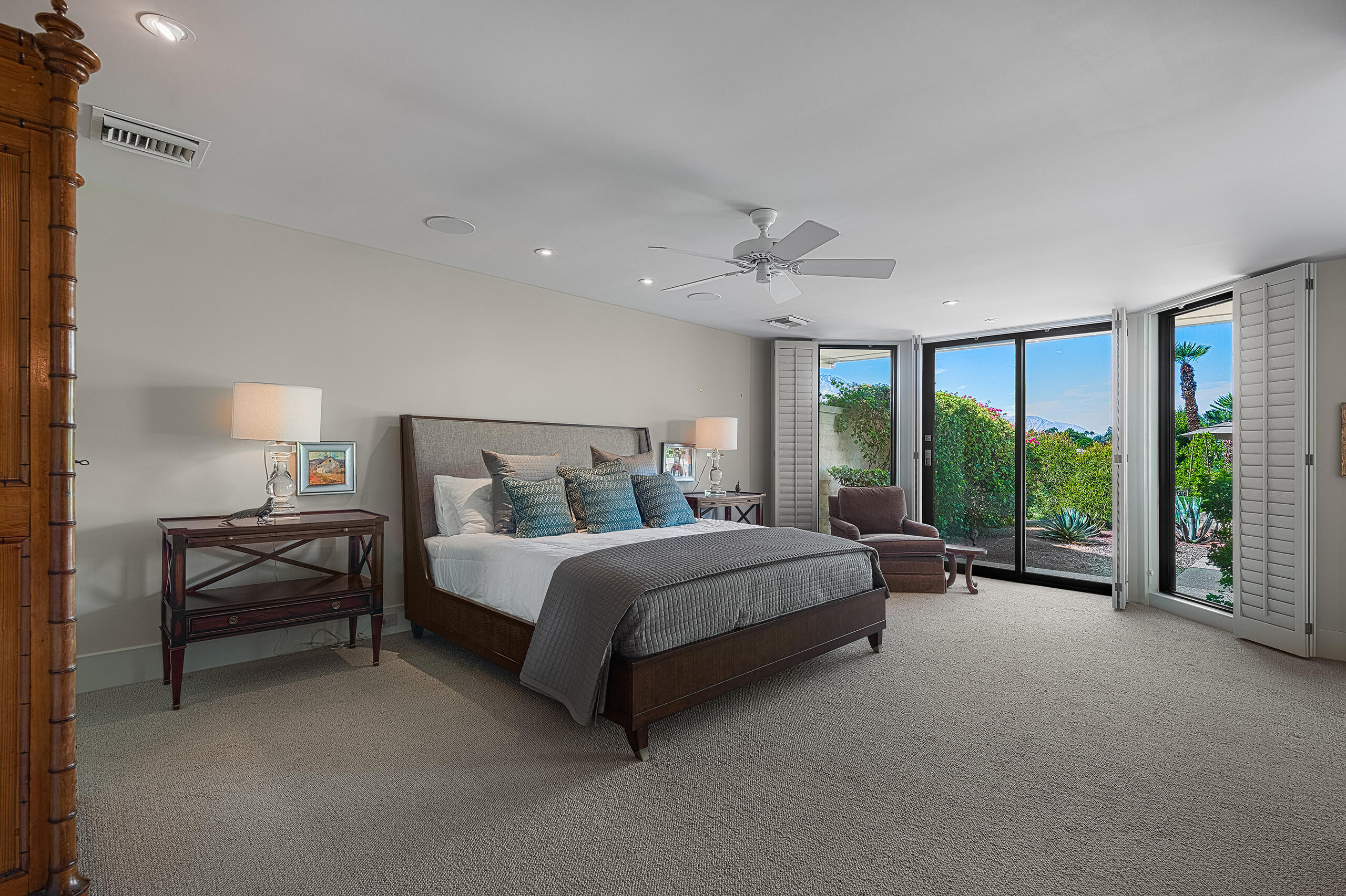 18 Creekside Drive Rancho Mirage, CA 92270 - Photo 26 of 40 a spacious bedroom with a bed and large window