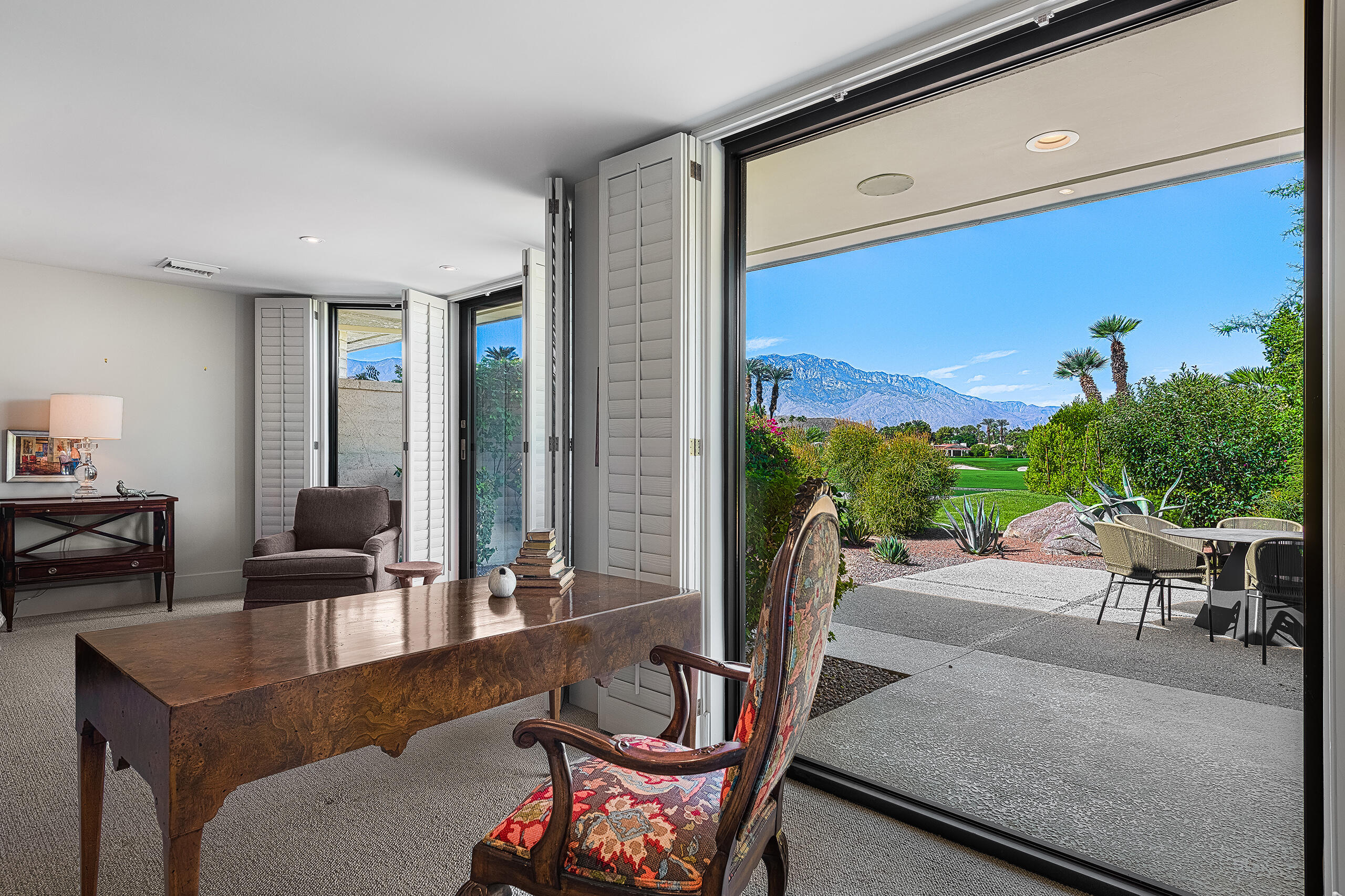 18 Creekside Drive Rancho Mirage, CA 92270 - Photo 28 of 40 a living room with furniture and a floor to ceiling window
