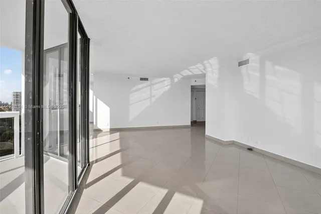 a view of an empty room and windows