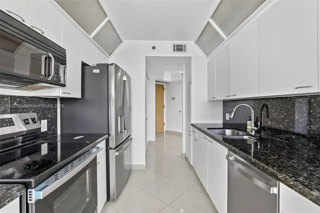 a bathroom with a shower and a sink