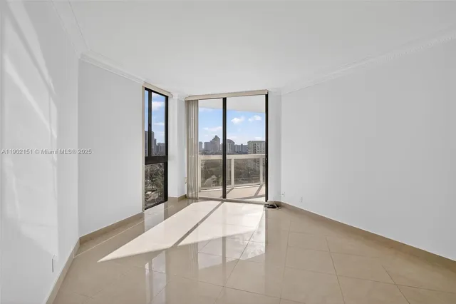 a view of a room with a floor to ceiling window and outside view