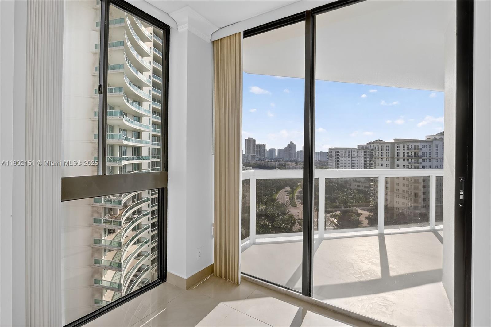 20185 East Country Club Drive, Unit 1405 Aventura, FL 33180 - Photo 22 of 67 a view of a room with window and floor to ceiling window