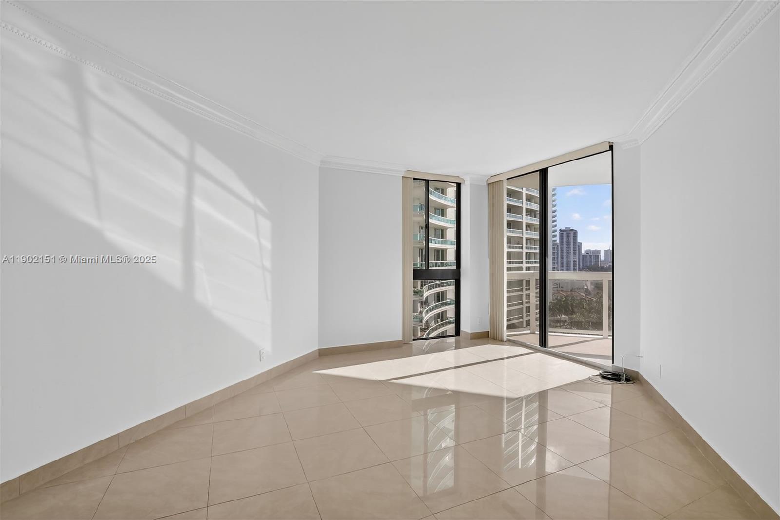 20185 East Country Club Drive, Unit 1405 Aventura, FL 33180 - Photo 23 of 67 an empty room with windows and closet