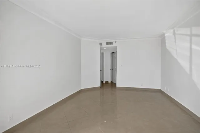 a view of a room with an empty shower