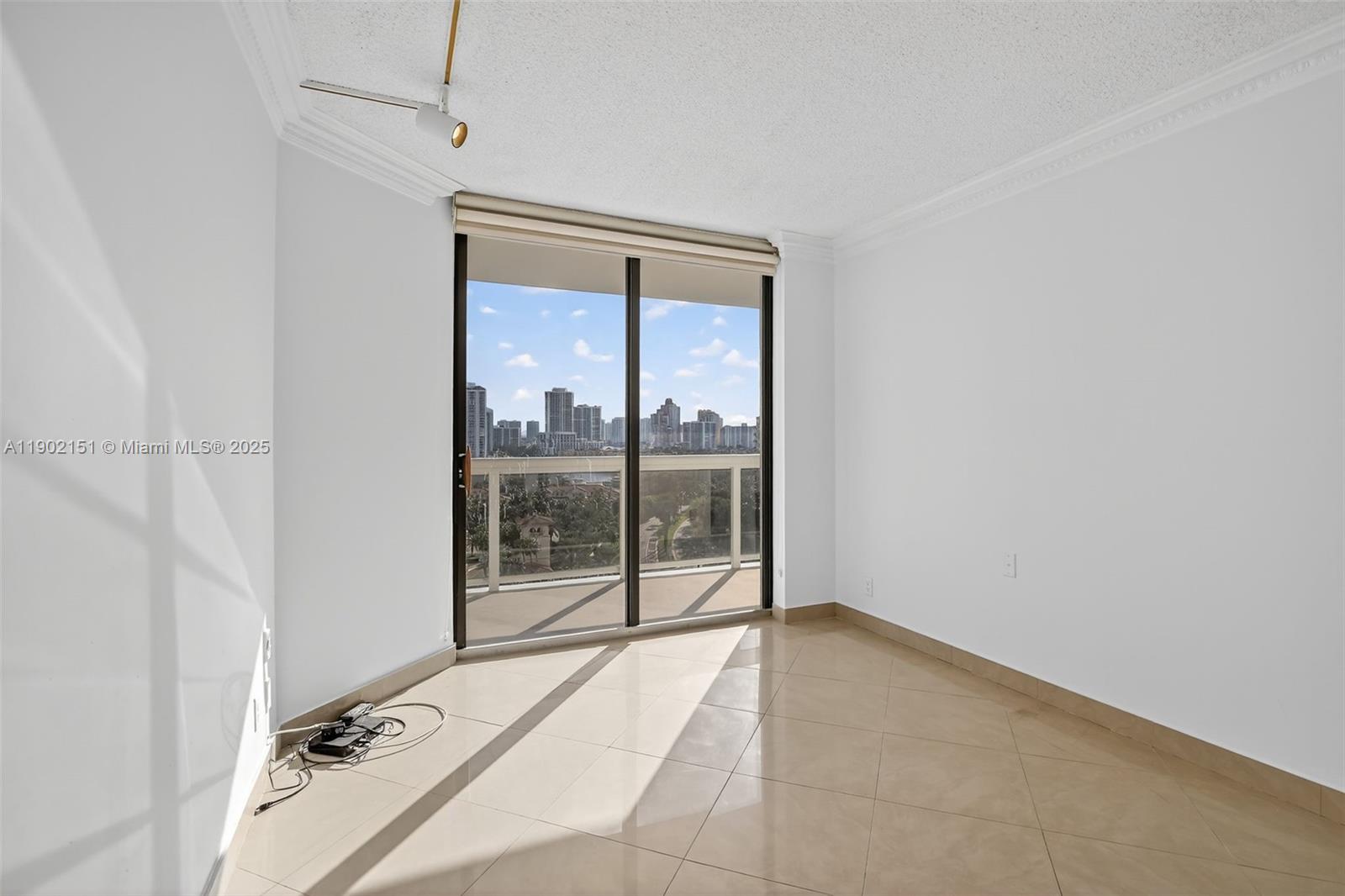 20185 East Country Club Drive, Unit 1405 Aventura, FL 33180 - Photo 29 of 67 a view of a room with a floor to ceiling window and outside view