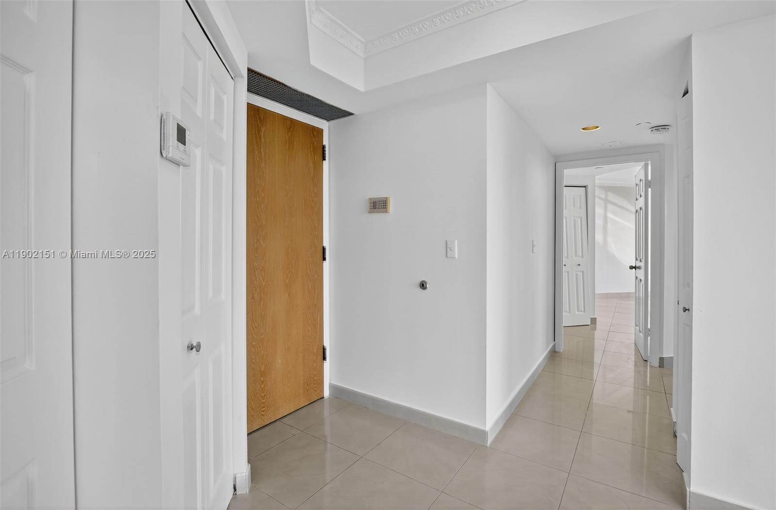 20185 East Country Club Drive, Unit 1405 Aventura, FL 33180 - Photo 33 of 67 a view of a hallway with wooden floor