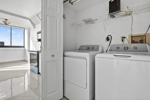 a lobby with furniture and floor to ceiling window