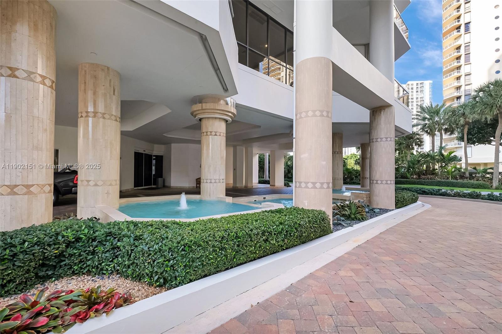 20185 East Country Club Drive, Unit 1405 Aventura, FL 33180 - Photo 41 of 67 a front view of a house with a yard