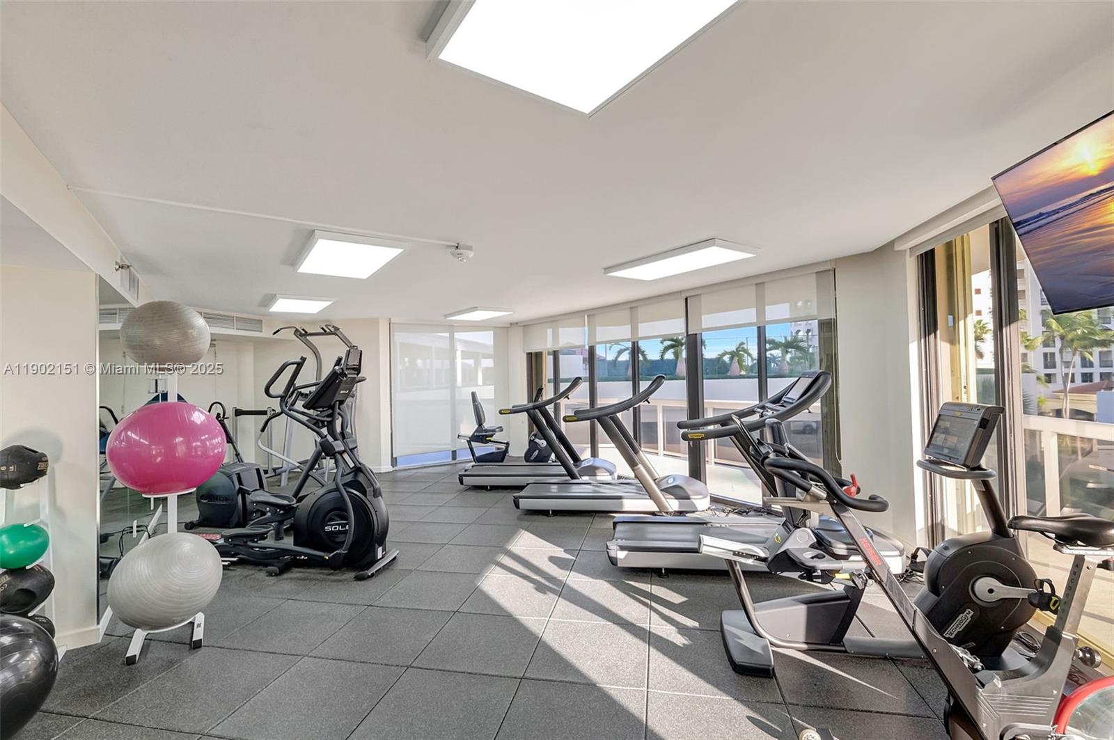 20185 East Country Club Drive, Unit 1405 Aventura, FL 33180 - Photo 49 of 67 a view of a room with gym equipment