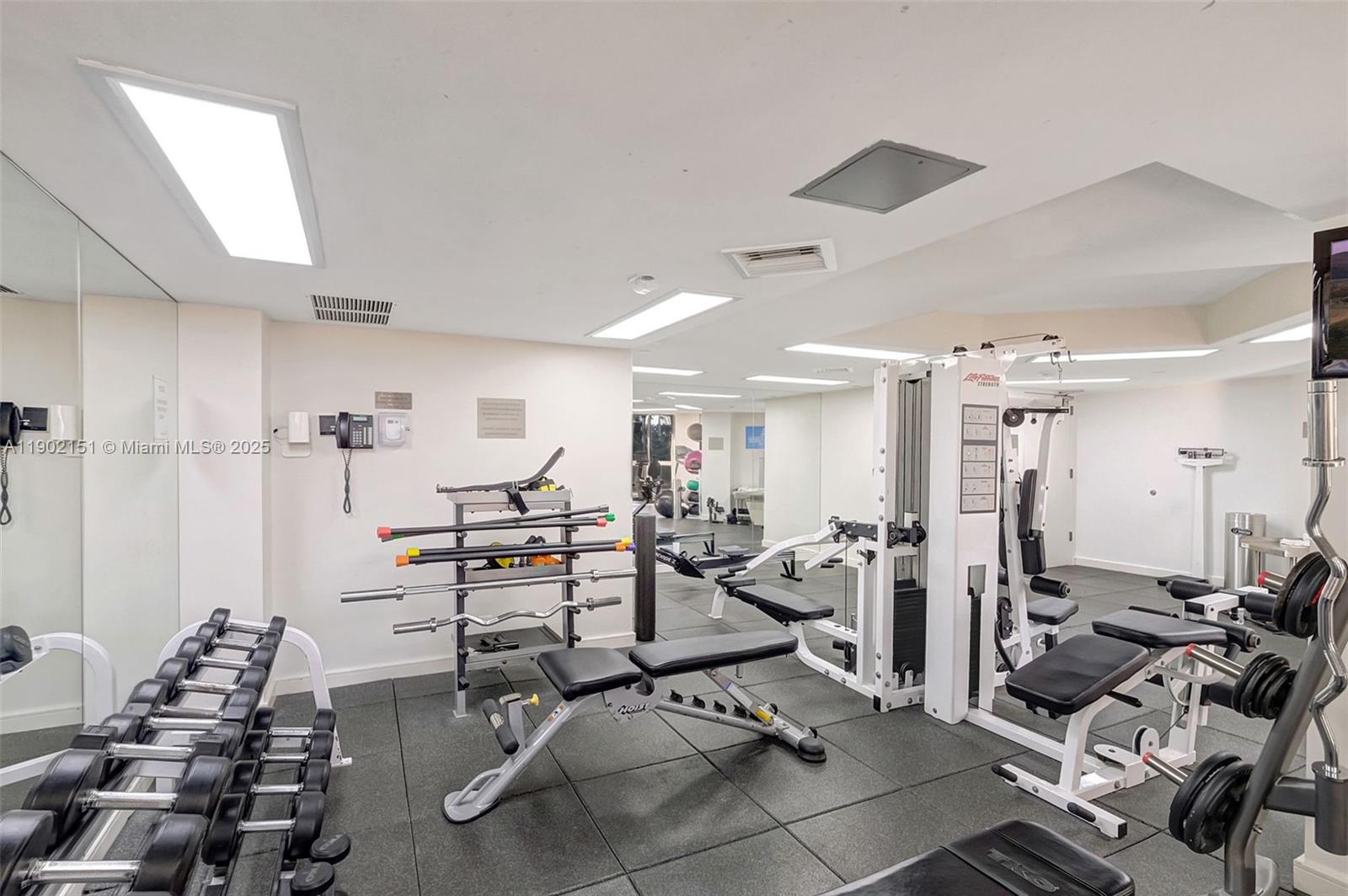 20185 East Country Club Drive, Unit 1405 Aventura, FL 33180 - Photo 51 of 67 a view of a room with gym equipment