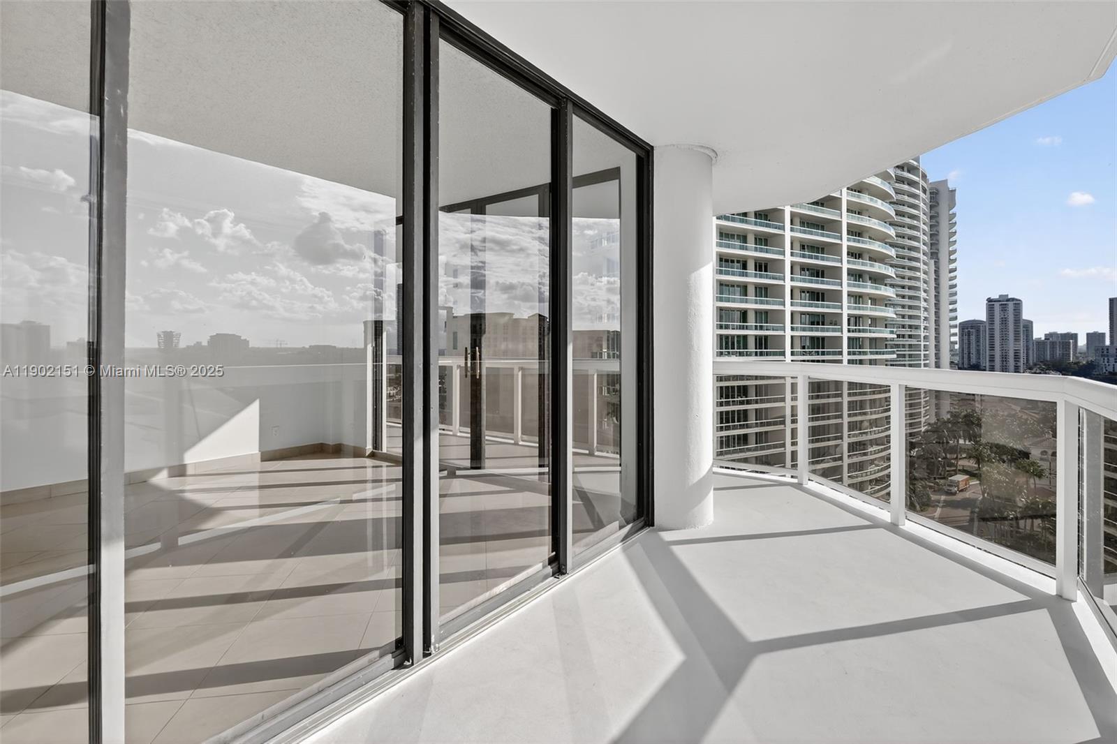 20185 East Country Club Drive, Unit 1405 Aventura, FL 33180 - Photo 66 of 67 a view of a balcony with floor to ceiling window
