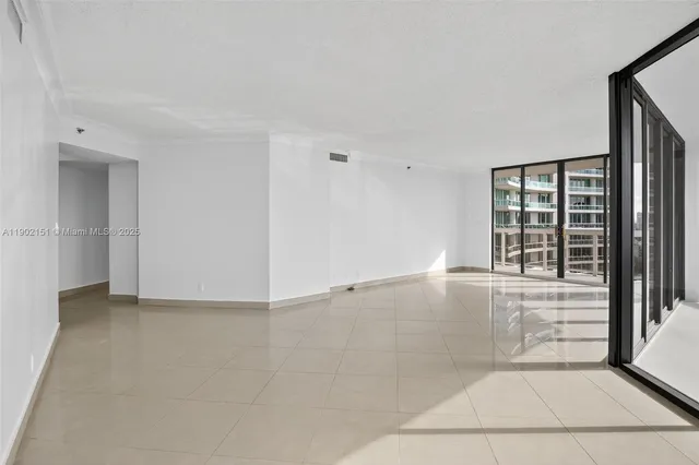 a view of an empty room with a balcony