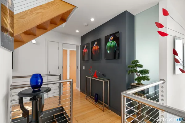 a kitchen with stainless steel appliances granite countertop a sink and a refrigerator