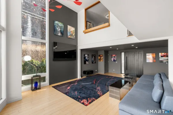 a living room with furniture rug and window