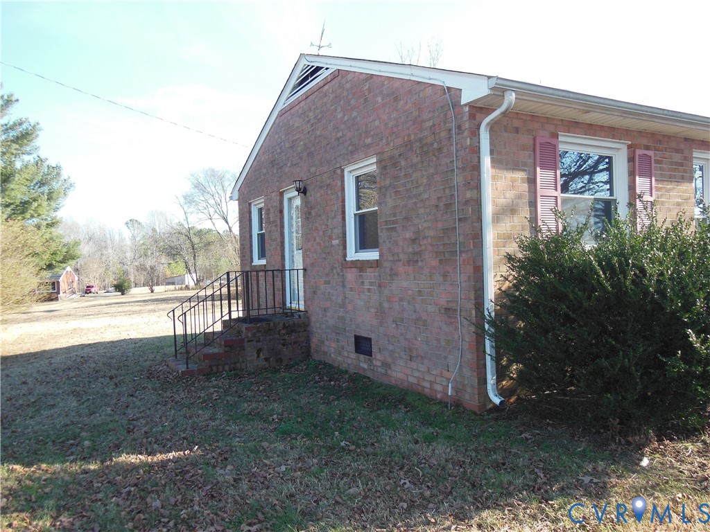 15647 Scotchtown Road Montpelier, VA 23192 - Photo 2 of 18 a view of a house with backyard and trees