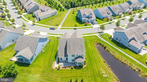 an aerial view of a house with a swimming pool