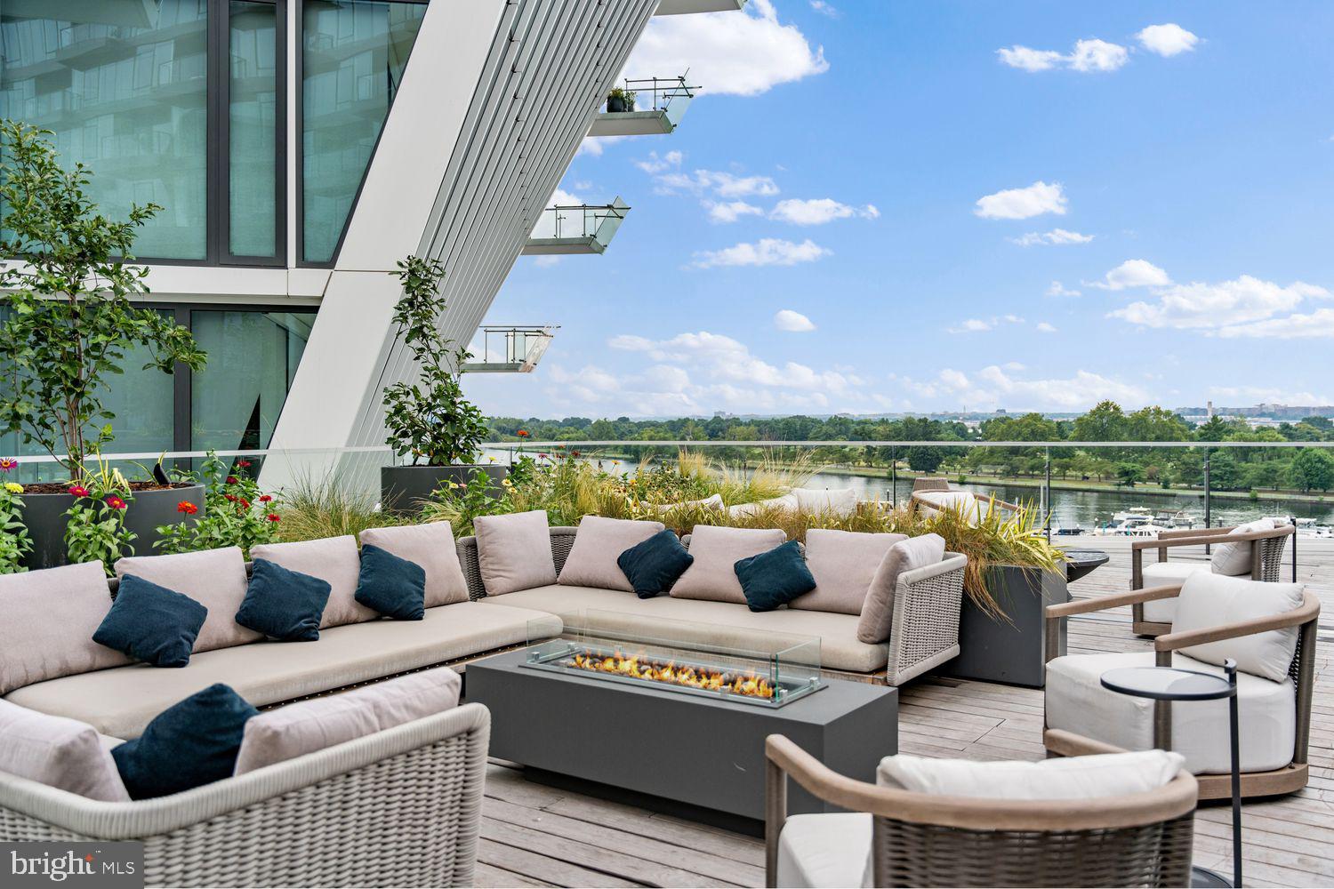 601 Wharf Street Southwest, Unit 301 Washington, DC 20024 - Photo 42 of 53 a roof deck with couches and potted plants