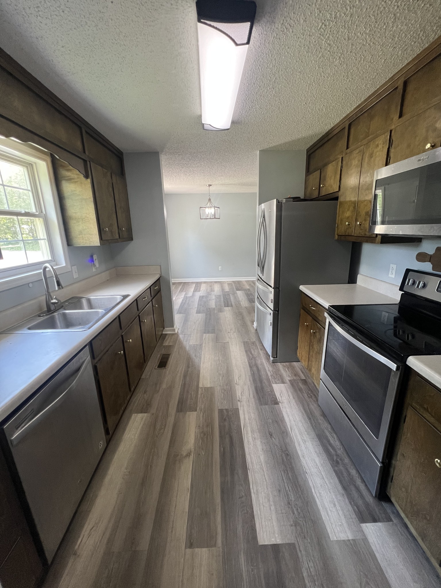 149 Hawthorne Street Pulaski, TN 38478 - Photo 11 of 33 a kitchen with a sink appliances and cabinets
