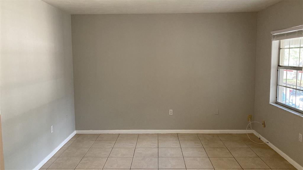 3718 West McKay Avenue, Unit 206 Tampa, FL 33609 - Photo 5 of 21 an empty room with windows