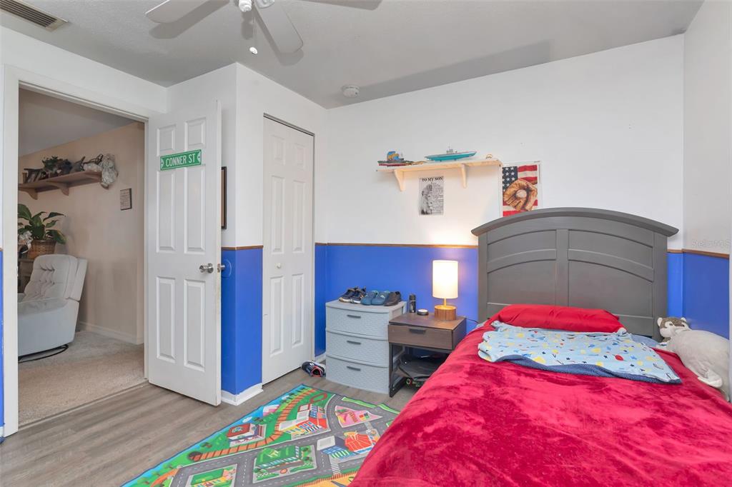 10301 Orchid Drive Port Richey, FL 34668 - Photo 19 of 35 a bedroom with a bed and a window