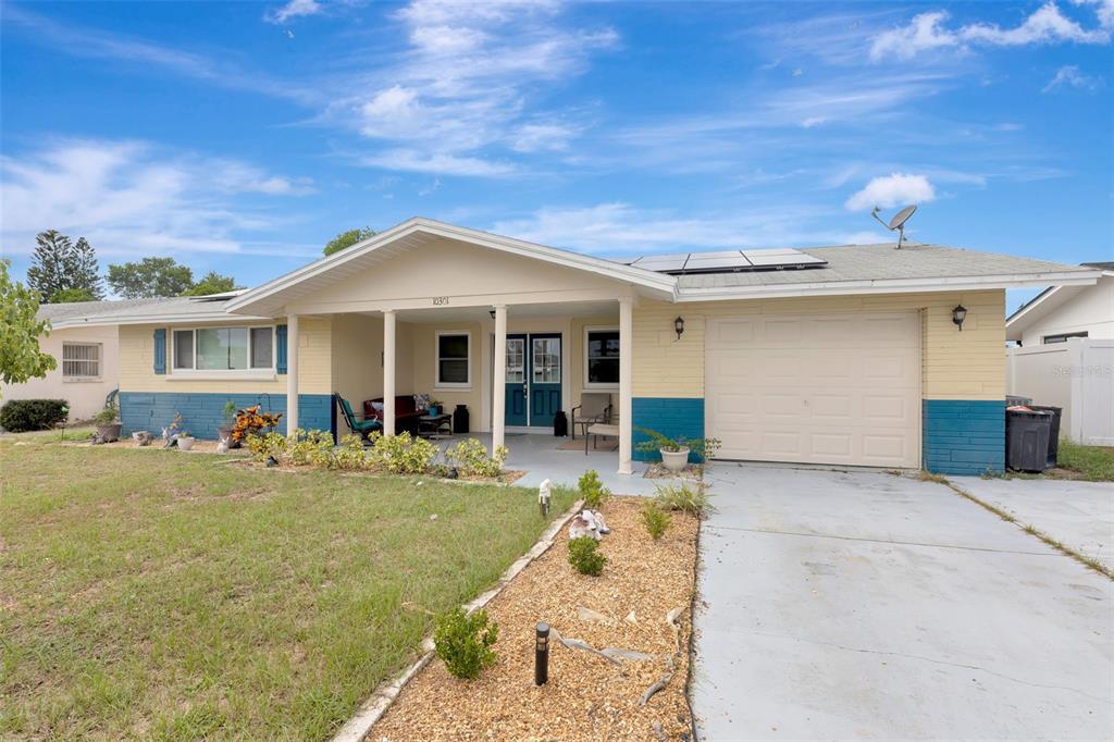 10301 Orchid Drive Port Richey, FL 34668 - Photo 2 of 35 a front view of a house with a porch