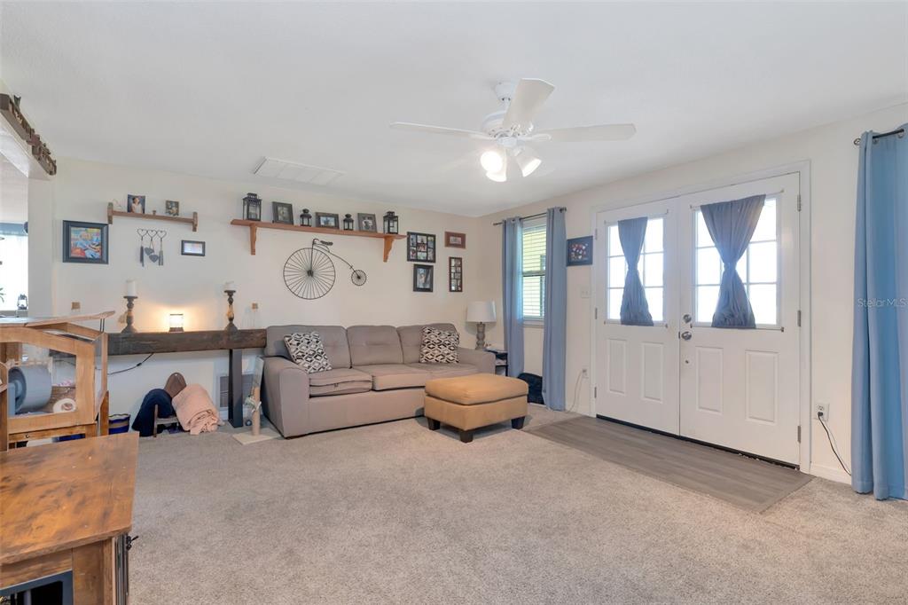 10301 Orchid Drive Port Richey, FL 34668 - Photo 22 of 35 a living room with furniture and a window