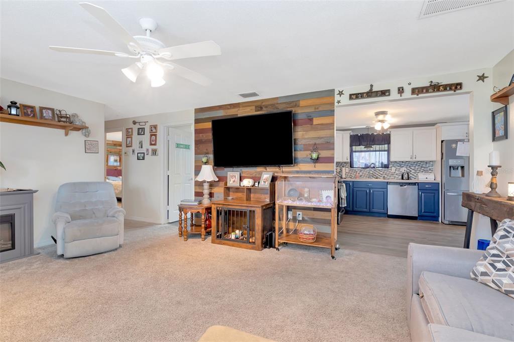 10301 Orchid Drive Port Richey, FL 34668 - Photo 27 of 35 a living room with furniture and a flat screen tv